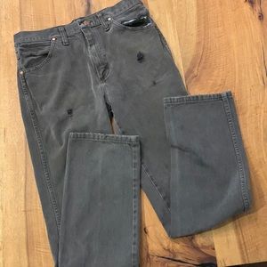 Distressed destroyed workwear wrangler jeans